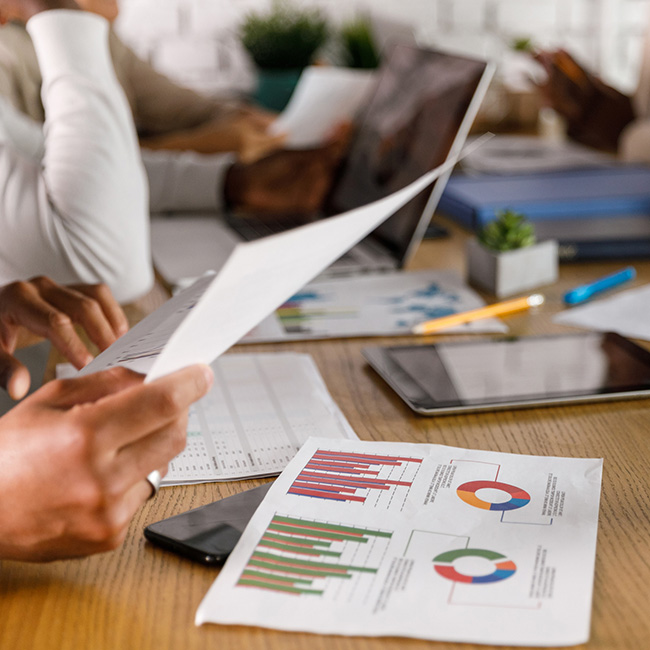 Several graphs on a table being looked at