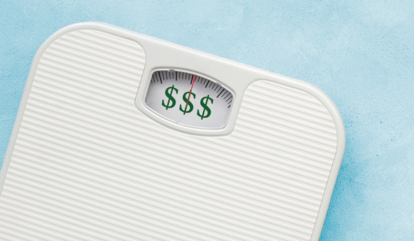 Weight scale showing money signs