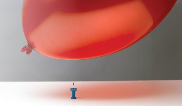 A balloon hovering over a tack